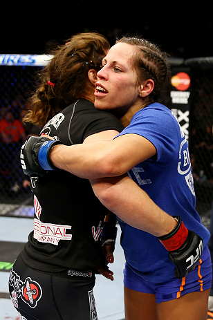 NEWARK, NJ - APRIL 27: Sheila Gaff (R)congratulates Sara McMann (L) on her win by KO/TKO in round one of their women's bantamweight bout during the UFC 159 event at the Prudential Center on April 27, 2013 in Newark, New Jersey. (Photo by Al Bello/Zuffa L