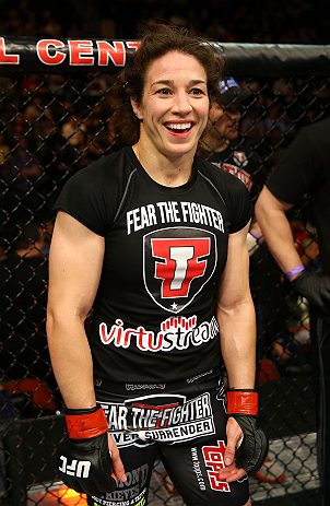 NEWARK, NJ - APRIL 27: Sara McMann celebrates defeating Sheila Gaff by KO/TKO in round one of their women's bantamweight bout during the UFC 159 event at the Prudential Center on April 27, 2013 in Newark, New Jersey. (Photo by Al Bello/Zuffa LLC/Zuffa L