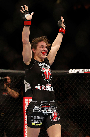 NEWARK, NJ - APRIL 27: Sara McMann reacts after defeating Sheila Gaff in their bantamweight fight during the UFC 159 event at the Prudential Center on April 27, 2013 in Newark, New Jersey. (Photo by Josh Hedges/Zuffa LLC/Zuffa LLC via Getty Images)