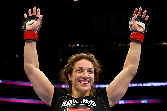 NEWARK, NJ - APRIL 27: Sara McMann celebrates defeating Sheila Gaff by KO/TKO in round one of their women's bantamweight bout during the UFC 159 event at the Prudential Center on April 27, 2013 in Newark, New Jersey. (Photo by Al Bello/Zuffa LLC/Zuffa L