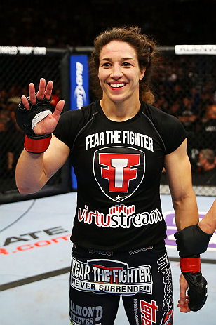 NEWARK, NJ - APRIL 27: Sara McMann celebrates defeating Sheila Gaff by KO/TKO in round one of their women's bantamweight bout during the UFC 159 event at the Prudential Center on April 27, 2013 in Newark, New Jersey. (Photo by Al Bello/Zuffa LLC/Zuffa L