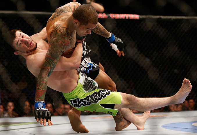 NEWARK, NJ - APRIL 27: (L-R) Rustam Khabilov takes down Yancy Medeiros in their lightweight fight during the UFC 159 event at the Prudential Center on April 27, 2013 in Newark, New Jersey. (Photo by Josh Hedges/Zuffa LLC/Zuffa LLC via Getty Images)