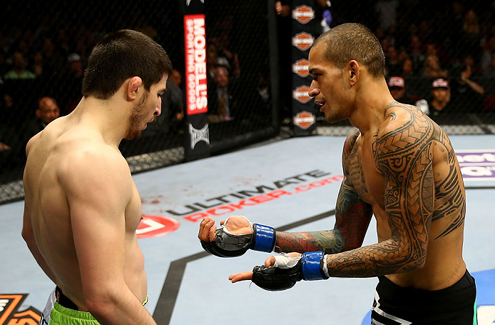 NEWARK, NJ - APRIL 27: Yancy Medeiros (R) shows his injury to Rustam Khabilov (L) of Russia after the stoppage of their lightweight bout during the UFC 159 event at the Prudential Center on April 27, 2013 in Newark, New Jersey. (Photo by Al Bello/Zuffa L