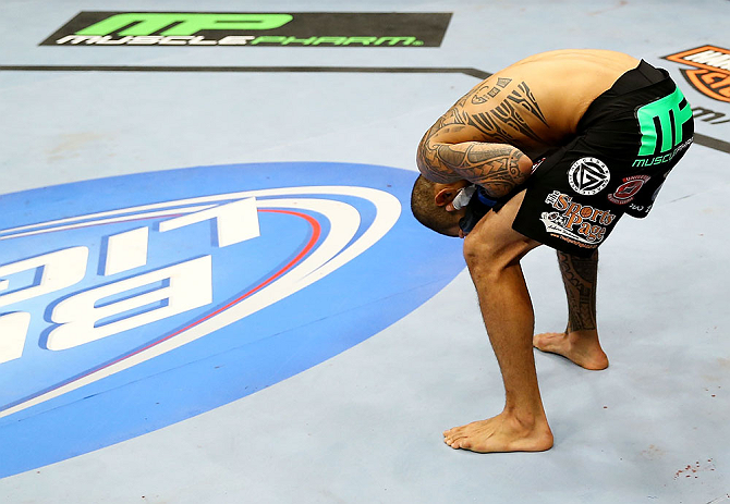 NEWARK, NJ - APRIL 27: Yancy Medeiros reacts after being injured during his lightweight bout against Rustam Khabilov of Russia during the UFC 159 event at the Prudential Center on April 27, 2013 in Newark, New Jersey. (Photo by Al Bello/Zuffa LLC/Zuffa L