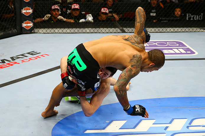 NEWARK, NJ - APRIL 27: Rustam Khabilov (bottom) of Russia takes down Yancy Medeiros (top) in their lightweight bout during the UFC 159 event at the Prudential Center on April 27, 2013 in Newark, New Jersey. (Photo by Al Bello/Zuffa LLC/Zuffa LLC Via Get
