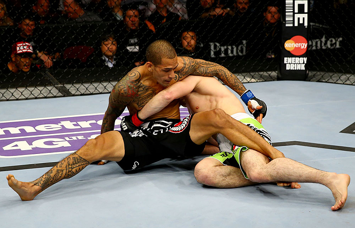 NEWARK, NJ - APRIL 27: Yancy Medeiros (L) struggles against Rustam Khabilov (R) of Russia in their lightweight bout during the UFC 159 event at the Prudential Center on April 27, 2013 in Newark, New Jersey. (Photo by Al Bello/Zuffa LLC/Zuffa LLC Via Gett