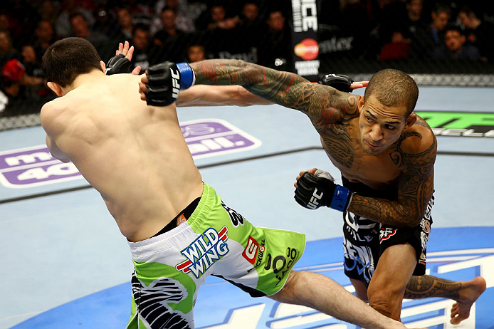 NEWARK, NJ - APRIL 27: Yancy Medeiros (R) throws a punch against Rustam Khabilov (L) of Russia in their lightweight bout during the UFC 159 event at the Prudential Center on April 27, 2013 in Newark, New Jersey. (Photo by Al Bello/Zuffa LLC/Zuffa LLC Vi