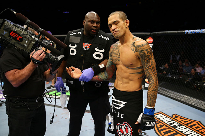 NEWARK, NJ - APRIL 27: Yancy Medeiros has his injured hand evaluated during his lightweight bout against Rustam Khabilov of Russia during the UFC 159 event at the Prudential Center on April 27, 2013 in Newark, New Jersey. (Photo by Al Bello/Zuffa LLC/Zuf