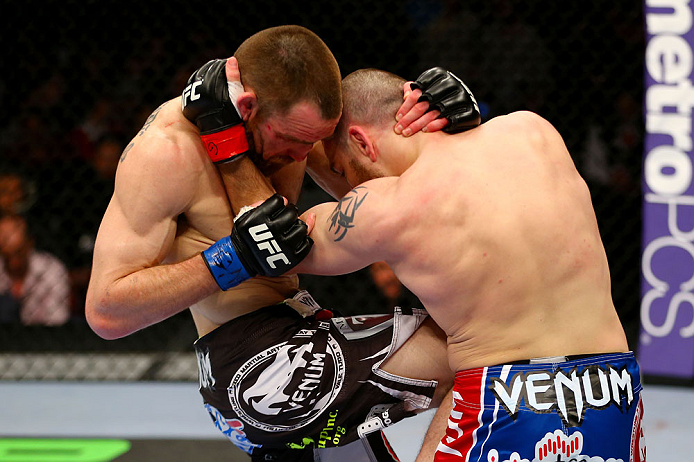 NEWARK, NJ - APRIL 27: Pat Healy (L) knees Jim Miller (R) in their lightweight bout during the UFC 159 event at the Prudential Center on April 27, 2013 in Newark, New Jersey. (Photo by Al Bello/Zuffa LLC/Zuffa LLC Via Getty Images)