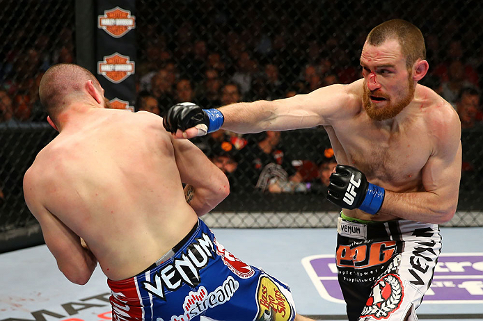 NEWARK, NJ - APRIL 27: Pat Healy (R) throws a punch against Jim Miller (L) in their lightweight bout during the UFC 159 event at the Prudential Center on April 27, 2013 in Newark, New Jersey. (Photo by Al Bello/Zuffa LLC/Zuffa LLC Via Getty Images)