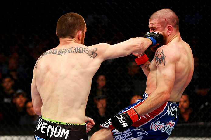 NEWARK, NJ - APRIL 27: (L-R) Pat Healy throws a right punch against Jim Miller in their lightweight bout during the UFC 159 event at the Prudential Center on April 27, 2013 in Newark, New Jersey. (Photo by Al Bello/Zuffa LLC/Zuffa LLC Via Getty Images)