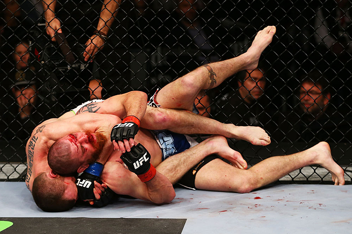 NEWARK, NJ - APRIL 27: Pat Healy performs a rear-naked choke against Jim Miller in the third round of their lightweight bout during the UFC 159 event at the Prudential Center on April 27, 2013 in Newark, New Jersey. (Photo by Al Bello/Zuffa LLC/Zuffa LLC
