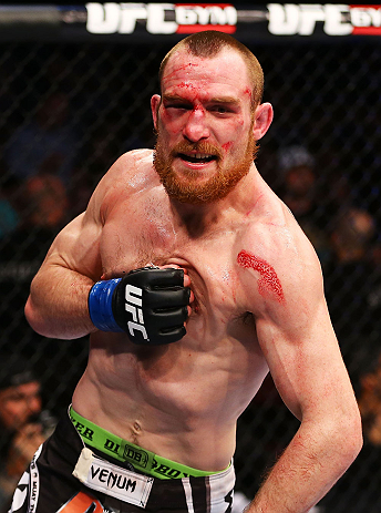 NEWARK, NJ - APRIL 27: Pat Healy celebrates defeating Jim Miller by Technical Submission (Rear-Naked Choke) in their lightweight bout during the UFC 159 event at the Prudential Center on April 27, 2013 in Newark, New Jersey. (Photo by Al Bello/Zuffa LLC