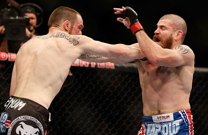 NEWARK, NJ - APRIL 27: (L-R) Pat Healy punches Jim Miller in their lightweight fight during the UFC 159 event at the Prudential Center on April 27, 2013 in Newark, New Jersey. (Photo by Josh Hedges/Zuffa LLC/Zuffa LLC via Getty Images)
