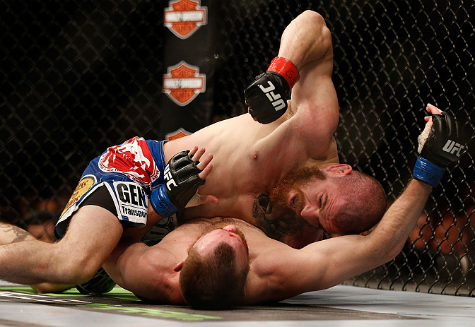 NEWARK, NJ - APRIL 27: Jim Miller (top) punches Pat Healy in their lightweight fight during the UFC 159 event at the Prudential Center on April 27, 2013 in Newark, New Jersey. (Photo by Josh Hedges/Zuffa LLC/Zuffa LLC via Getty Images)
