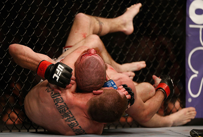 NEWARK, NJ - APRIL 27: (L-R) Pat Healy secures a rear choke submission against Jim Miller in their lightweight fight during the UFC 159 event at the Prudential Center on April 27, 2013 in Newark, New Jersey. (Photo by Josh Hedges/Zuffa LLC/Zuffa LLC vi