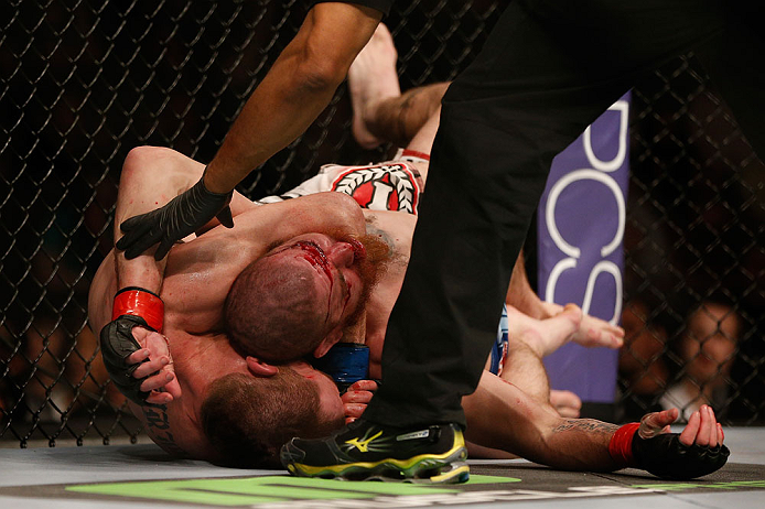 NEWARK, NJ - APRIL 27: (L-R) Pat Healy secures a rear choke submission against Jim Miller in their lightweight fight during the UFC 159 event at the Prudential Center on April 27, 2013 in Newark, New Jersey. (Photo by Josh Hedges/Zuffa LLC/Zuffa LLC vi