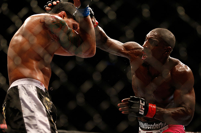 NEWARK, NJ - APRIL 27: (R-L) Phil Davis punches Vinny Magalhaes in their light heavyweight fight during the UFC 159 event at the Prudential Center on April 27, 2013 in Newark, New Jersey. (Photo by Josh Hedges/Zuffa LLC/Zuffa LLC via Getty Images)