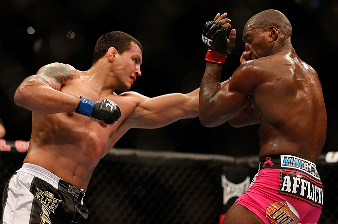 NEWARK, NJ - APRIL 27: (L-R) Vinny Magalhaes punches Phil Davis in their light heavyweight fight during the UFC 159 event at the Prudential Center on April 27, 2013 in Newark, New Jersey. (Photo by Josh Hedges/Zuffa LLC/Zuffa LLC via Getty Images)