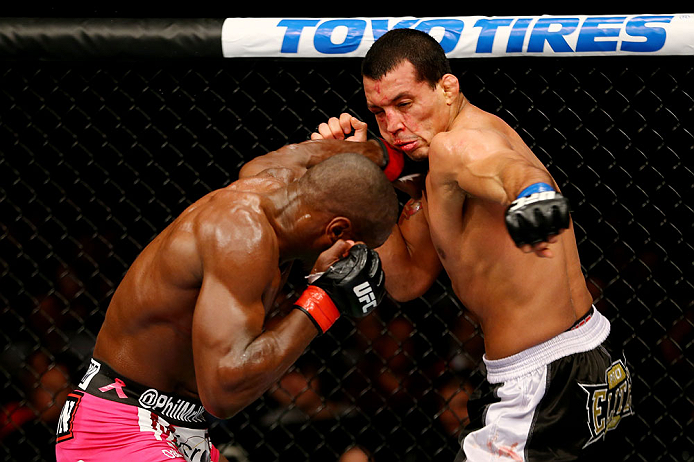 NEWARK, NJ - APRIL 27: Phil Davis throws a punch against Vinny Magalhaes in their light heavyweight bout during the UFC 159 event at the Prudential Center on April 27, 2013 in Newark, New Jersey. (Photo by Al Bello/Zuffa LLC/Zuffa LLC Via Getty Images)