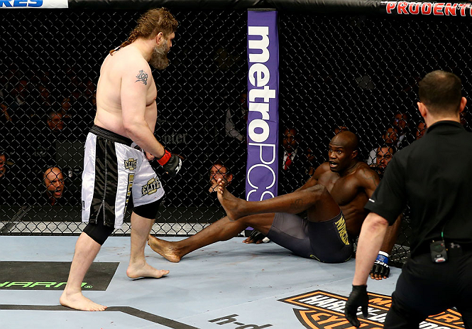 NEWARK, NJ - APRIL 27: Cheick Kongo (R) of France sits against the cage as Roy Nelson (L) approaches in their heavyweight bout during the UFC 159 event at the Prudential Center on April 27, 2013 in Newark, New Jersey. (Photo by Al Bello/Zuffa LLC/Zuffa