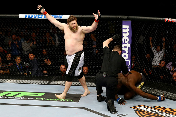 NEWARK, NJ - APRIL 27: Roy Nelson (L) celebrates his win by knockout against Cheick Kongo (R) of France in their heavyweight bout during the UFC 159 event at the Prudential Center on April 27, 2013 in Newark, New Jersey. (Photo by Al Bello/Zuffa LLC/Zuf