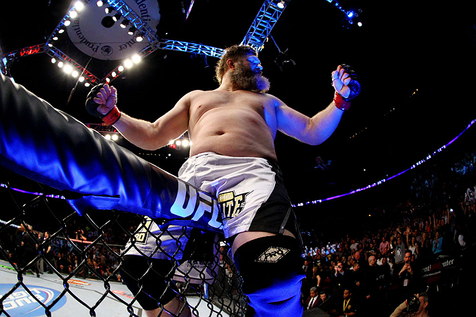 NEWARK, NJ - APRIL 27: Roy Nelson sits on the side of the octagon in celebration of his win by knockout against Cheick Kongo of France in their heavyweight bout during the UFC 159 event at the Prudential Center on April 27, 2013 in Newark, New Jersey. (