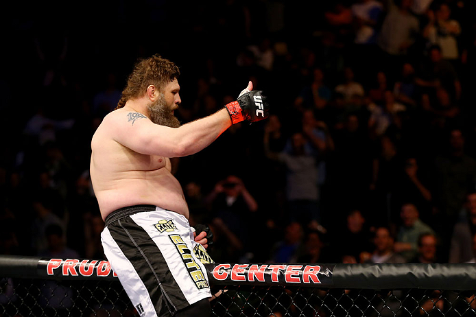 NEWARK, NJ - APRIL 27: Roy Nelson sits on the side of the octagon in celebration of his win by knockout against Cheick Kongo of France in their heavyweight bout during the UFC 159 event at the Prudential Center on April 27, 2013 in Newark, New Jersey. (