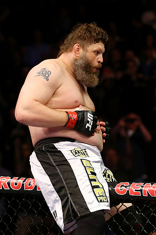 NEWARK, NJ - APRIL 27: Roy Nelson sits on the side of the octagon in celebration of his win by knockout against Cheick Kongo of France in their heavyweight bout during the UFC 159 event at the Prudential Center on April 27, 2013 in Newark, New Jersey. (