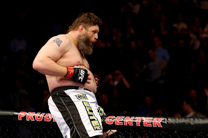 NEWARK, NJ - APRIL 27: Roy Nelson sits on the side of the octagon in celebration of his win by knockout against Cheick Kongo of France in their heavyweight bout during the UFC 159 event at the Prudential Center on April 27, 2013 in Newark, New Jersey. (