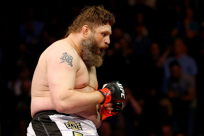 NEWARK, NJ - APRIL 27: Roy Nelson sits on the side of the octagon in celebration of his win by knockout against Cheick Kongo of France in their heavyweight bout during the UFC 159 event at the Prudential Center on April 27, 2013 in Newark, New Jersey. (
