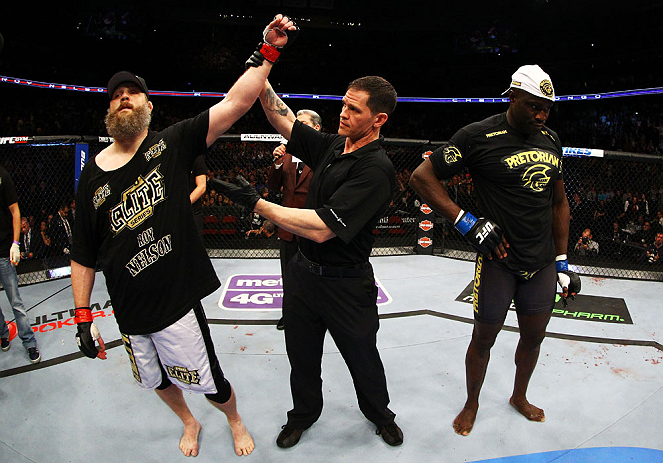 NEWARK, NJ - APRIL 27: Cheick Kongo (R) of France reacts as Roy Nelson (L) is announced winner by knockout by referee Kevin Mulhall (C) after their heavyweight bout during the UFC 159 event at the Prudential Center on April 27, 2013 in Newark, New Jersey