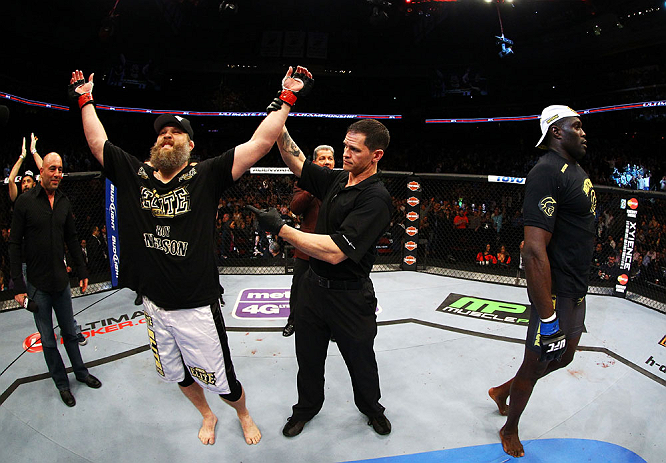NEWARK, NJ - APRIL 27: Cheick Kongo (R) of France walks away as Roy Nelson (L) is announced winner by knockout by referee Kevin Mulhall (C) after their heavyweight bout during the UFC 159 event at the Prudential Center on April 27, 2013 in Newark, New Je