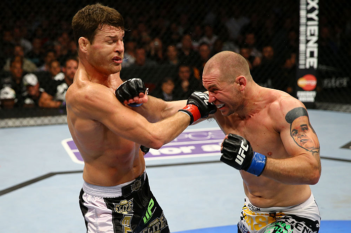 NEWARK, NJ - APRIL 27: (L-R) Michael Bisping of England exchanges punches with Alan Belcher in their middleweight bout during the UFC 159 event at the Prudential Center on April 27, 2013 in Newark, New Jersey. (Photo by Al Bello/Zuffa LLC/Zuffa LLC Via G