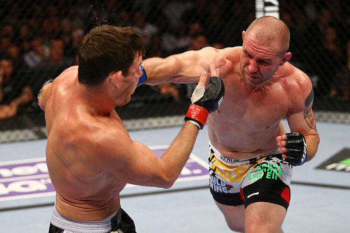 NEWARK, NJ - APRIL 27: Alan Belcher (R) punches Michael Bisping (L) of England in thier middleweight bout during the UFC 159 event at the Prudential Center on April 27, 2013 in Newark, New Jersey. (Photo by Al Bello/Zuffa LLC/Zuffa LLC Via Getty Images)