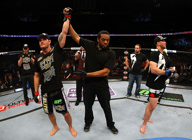 NEWARK, NJ - APRIL 27: Michael Bisping (L) of England is announced winner by unanimous decision against Alan Belcher (R) in their middleweight bout during the UFC 159 event at the Prudential Center on April 27, 2013 in Newark, New Jersey. (Photo by Al Be
