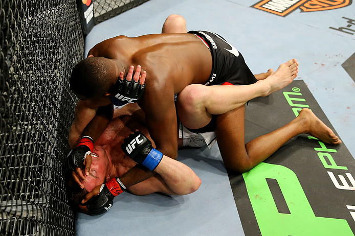 NEWARK, NJ - APRIL 27: Jon Jones (top) battles against Chael Sonnen (bottom) in the first round of their light heavyweight championship bout during the UFC 159 event at the Prudential Center on April 27, 2013 in Newark, New Jersey. (Photo by Al Bello/Z