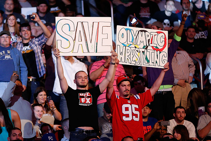NEWARK, NJ - APRIL 27: Fans display a sign in support of saving Olympic wresling during the UFC 159 event at the Prudential Center on April 27, 2013 in Newark, New Jersey. (Photo by Josh Hedges/Zuffa LLC/Zuffa LLC via Getty Images)