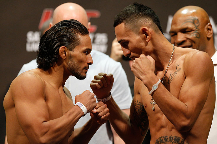 LAS VEGAS, NV - MAY 24: (L-R) Opponents Dennis Bermudez and Max Holloway face off during the UFC 160 weigh-in at the MGM Grand Garden Arena on May 24, 2013 in Las Vegas, Nevada. (Photo by Josh Hedges/Zuffa LLC/Zuffa LLC via Getty Images)