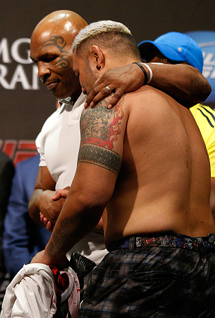 LAS VEGAS, NV - MAY 24: (L-R) Former heavyweight boxing champion Mike Tyson greets Mark Hunt during the UFC 160 weigh-in at the MGM Grand Garden Arena on May 24, 2013 in Las Vegas, Nevada. (Photo by Josh Hedges/Zuffa LLC/Zuffa LLC via Getty Images)