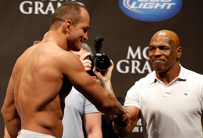 LAS VEGAS, NV - MAY 24: (R-L) Former heavyweight boxing champion Mike Tyson greets Junior dos Santos during the UFC 160 weigh-in at the MGM Grand Garden Arena on May 24, 2013 in Las Vegas, Nevada. (Photo by Josh Hedges/Zuffa LLC/Zuffa LLC via Getty Ima