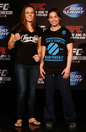 WINNIPEG, CANADA - JUNE 13: (L-R) Opponents Alexis Davis and Rosi Sexton pose for photos during the UFC 161 media day at The Met on June 13, 2013 in Winnipeg, Manitoba, Canada. (Photo by Josh Hedges/Zuffa LLC/Zuffa LLC via Getty Images)