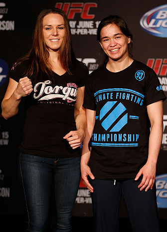 WINNIPEG, CANADA - JUNE 13: (L-R) Opponents Alexis Davis and Rosi Sexton pose for photos during the UFC 161 media day at The Met on June 13, 2013 in Winnipeg, Manitoba, Canada. (Photo by Josh Hedges/Zuffa LLC/Zuffa LLC via Getty Images)