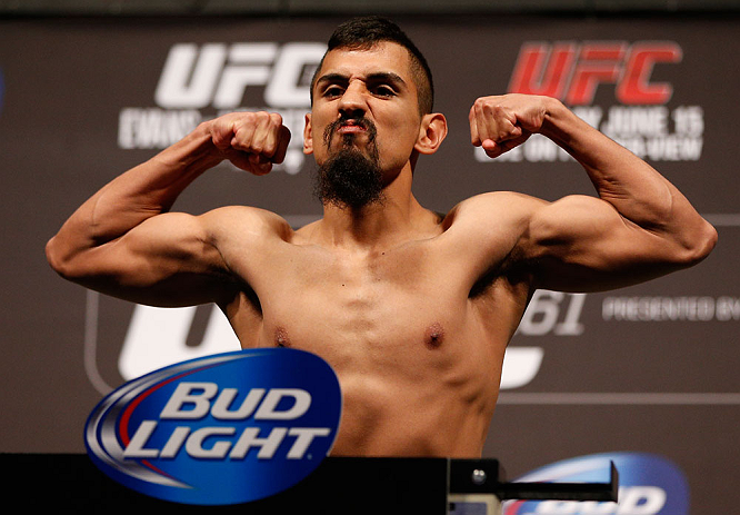 WINNIPEG, CANADA - JUNE 14: Edwin Figueroa weighs in during the UFC 161 weigh-in at the MTS Centre on June 14, 2013 in Winnipeg, Manitoba, Canada. (Photo by Josh Hedges/Zuffa LLC/Zuffa LLC via Getty Images)