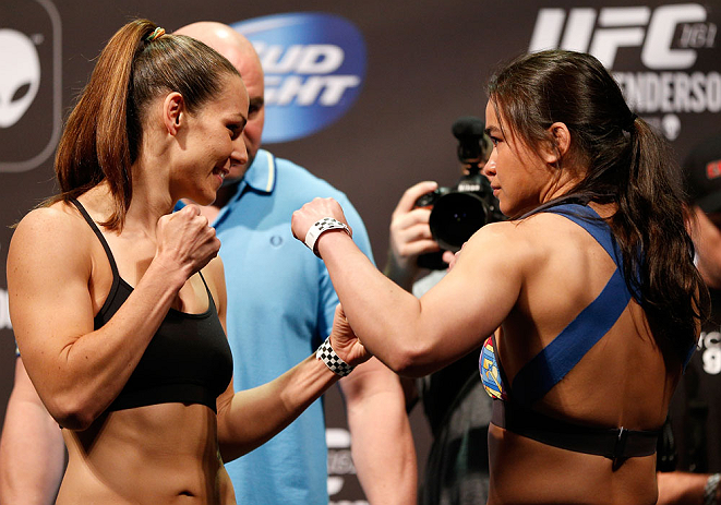 WINNIPEG, CANADA - JUNE 14: (L-R) Opponents Alexis Davis and Rosi Sexton face off during the UFC 161 weigh-in at the MTS Centre on June 14, 2013 in Winnipeg, Manitoba, Canada. (Photo by Josh Hedges/Zuffa LLC/Zuffa LLC via Getty Images)