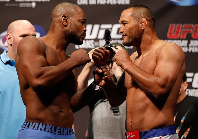 WINNIPEG, CANADA - JUNE 14: (L-R) Opponents Rashad Evans and Dan Henderson face off during the UFC 161 weigh-in at the MTS Centre on June 14, 2013 in Winnipeg, Manitoba, Canada. (Photo by Josh Hedges/Zuffa LLC/Zuffa LLC via Getty Images)