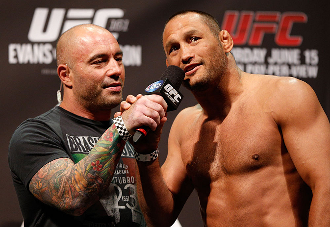 WINNIPEG, CANADA - JUNE 14: (R-L) Dan Henderson is interviewed by Joe Rogan during the UFC 161 weigh-in at the MTS Centre on June 14, 2013 in Winnipeg, Manitoba, Canada. (Photo by Josh Hedges/Zuffa LLC/Zuffa LLC via Getty Images)
