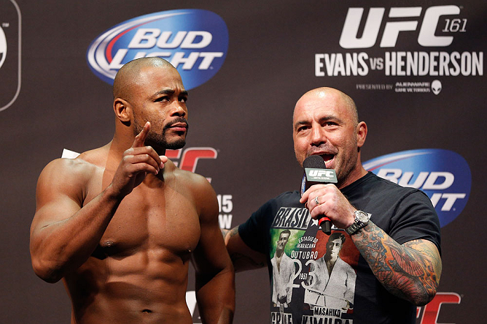 WINNIPEG, CANADA - JUNE 14: (L-R) Rashad Evans is interviewed by Joe Rogan during the UFC 161 weigh-in at the MTS Centre on June 14, 2013 in Winnipeg, Manitoba, Canada. (Photo by Josh Hedges/Zuffa LLC/Zuffa LLC via Getty Images)