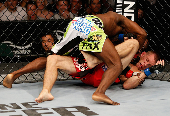 WINNIPEG, CANADA - JUNE 15: (L-R) Yves Jabouin punches Dustin Pague in their bantamweight fight during the UFC 161 event at the MTS Centre on June 15, 2013 in Winnipeg, Manitoba, Canada. (Photo by Josh Hedges/Zuffa LLC/Zuffa LLC via Getty Images)