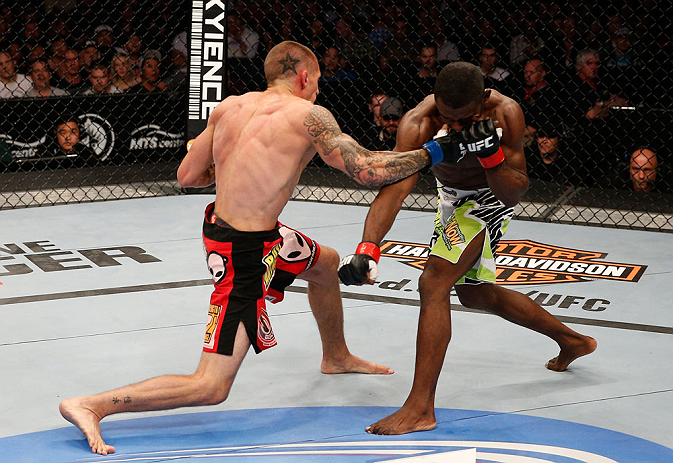 WINNIPEG, CANADA - JUNE 15: (L-R) Dustin Pague punches Yves Jabouin in their bantamweight fight during the UFC 161 event at the MTS Centre on June 15, 2013 in Winnipeg, Manitoba, Canada. (Photo by Josh Hedges/Zuffa LLC/Zuffa LLC via Getty Images)